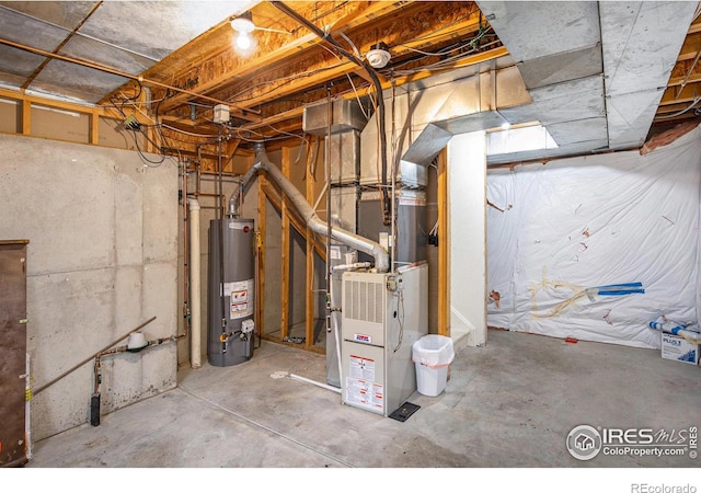 utility room featuring heating unit and gas water heater