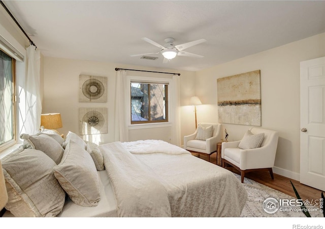 bedroom with ceiling fan and hardwood / wood-style floors