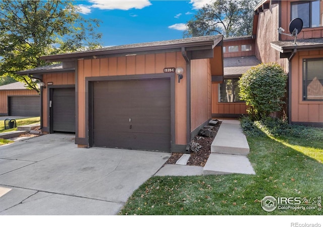 exterior space with a front lawn and a garage