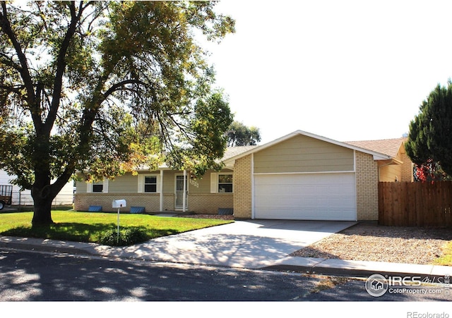 ranch-style house with a front yard and a garage