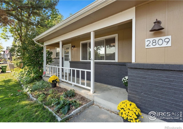 property entrance featuring covered porch