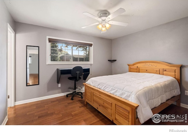 bedroom featuring ceiling fan and dark hardwood / wood-style floors