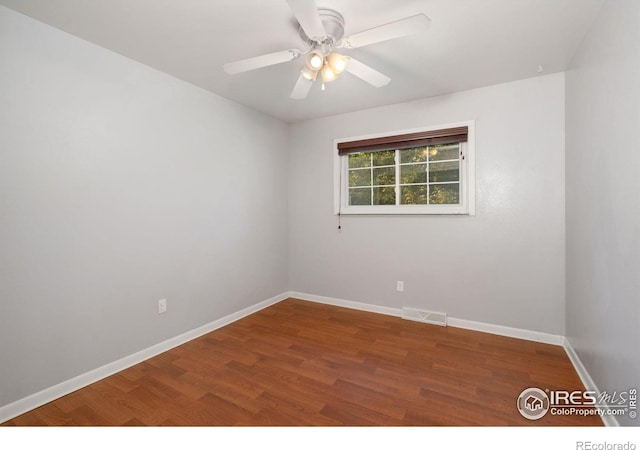 unfurnished room featuring hardwood / wood-style floors and ceiling fan