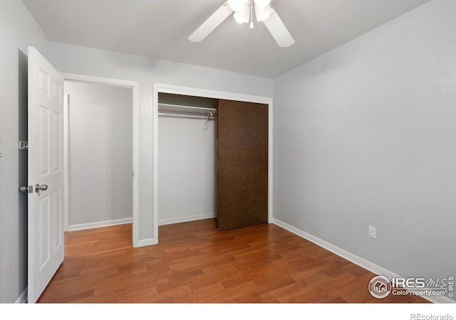 unfurnished bedroom with ceiling fan and hardwood / wood-style floors