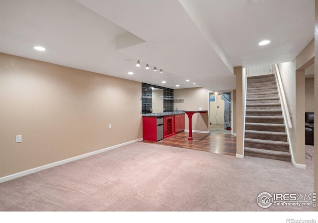 interior space featuring carpet and indoor bar