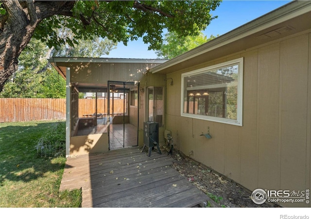 wooden deck featuring a yard