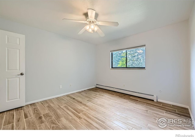 unfurnished room with ceiling fan, a baseboard heating unit, and light wood-type flooring