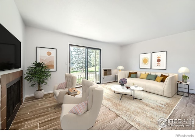 living room with a baseboard radiator, hardwood / wood-style floors, and a fireplace