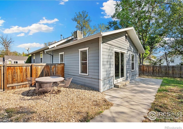 view of side of property with a patio