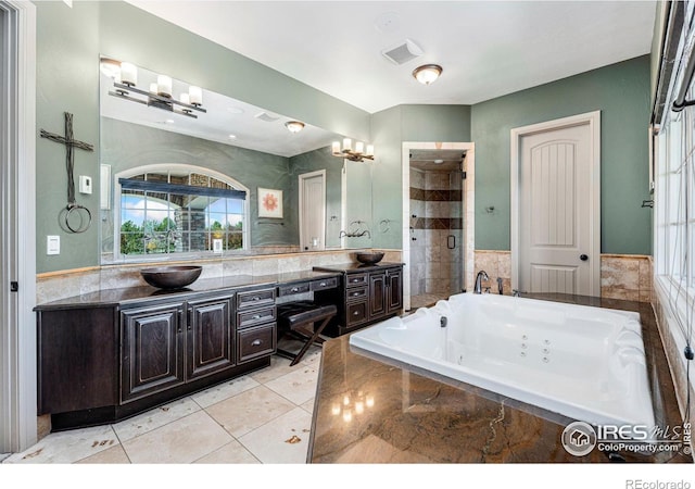 bathroom with vanity, tile walls, shower with separate bathtub, and tile patterned flooring