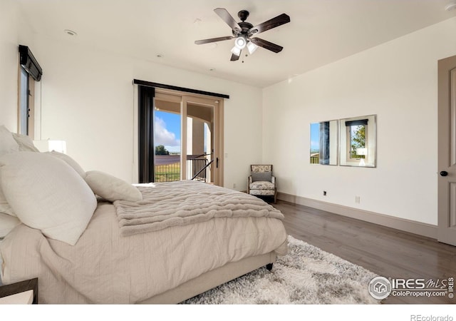 bedroom with access to outside, wood finished floors, baseboards, and a ceiling fan