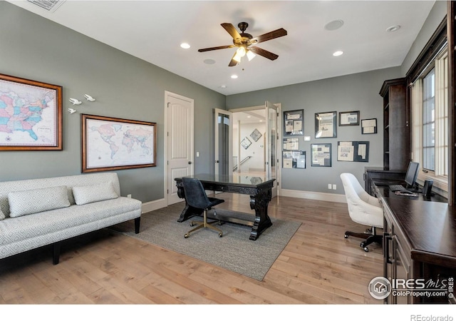 office area with light wood-type flooring and ceiling fan