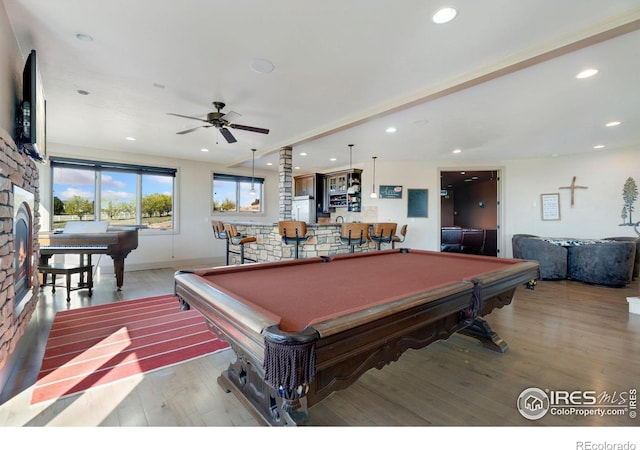 recreation room featuring billiards table, wood finished floors, ceiling fan, recessed lighting, and bar area