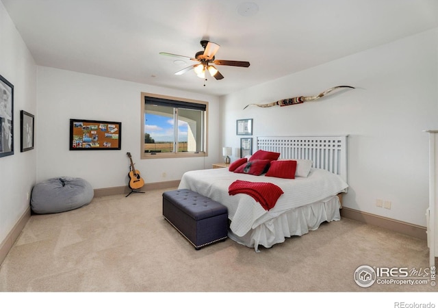 bedroom featuring ceiling fan and light carpet