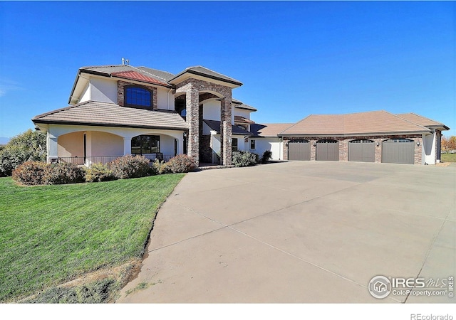 view of front facade featuring a front yard and a garage