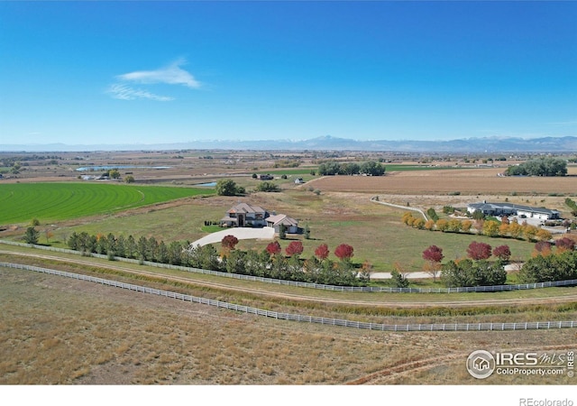 drone / aerial view with a mountain view and a rural view