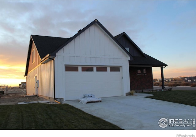 property exterior at dusk with a yard