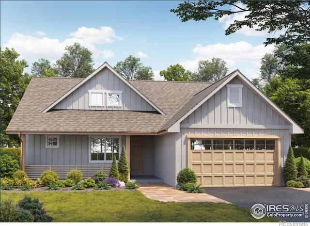 view of front of property featuring a garage, board and batten siding, and a shingled roof