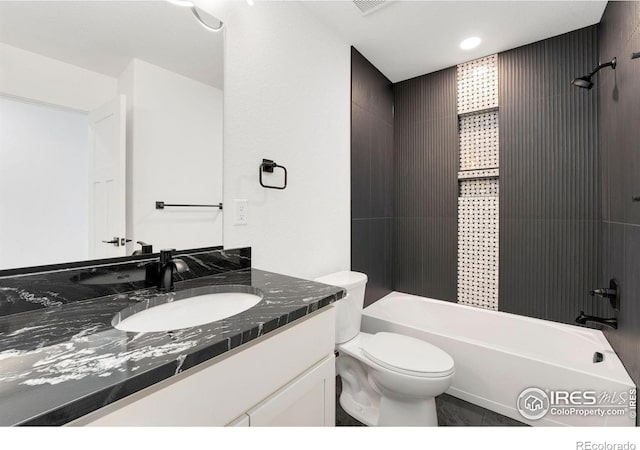 full bathroom with vanity, shower / tub combination, and toilet