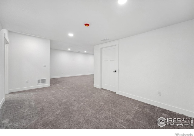 448 Cache Ave, Fort Morgan, CO 80701 - finished basement with baseboards, visible vents, carpet floors, and recessed lighting
