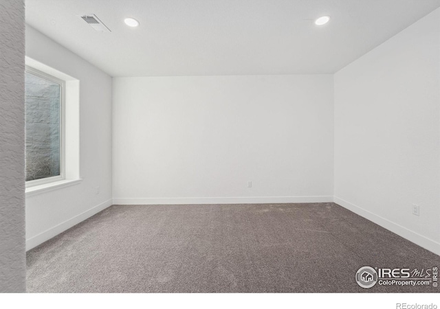 448 Cache Ave, Fort Morgan, CO 80701 - empty room featuring baseboards, carpet flooring, visible vents, and recessed lighting