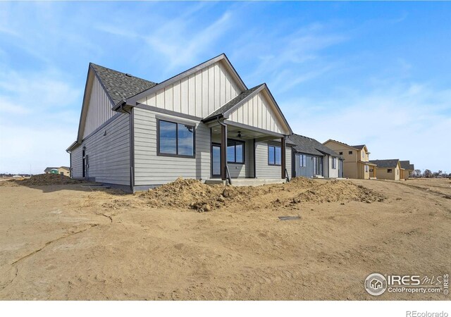448 Cache Ave, Fort Morgan, CO 80701 - exterior space featuring board and batten siding