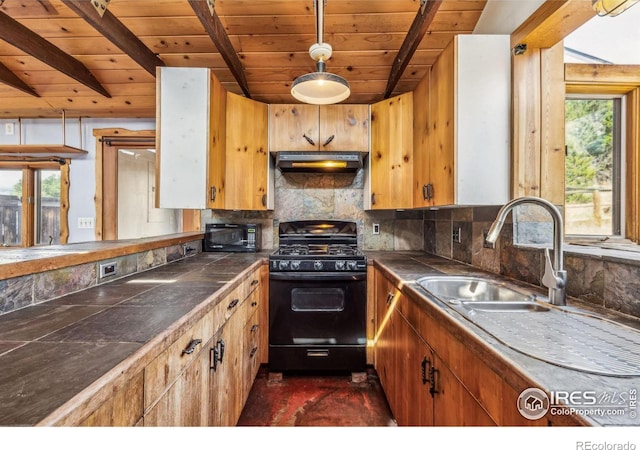 kitchen with wood ceiling, backsplash, a healthy amount of sunlight, and black appliances