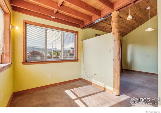 spare room with lofted ceiling, wood ceiling, and concrete flooring