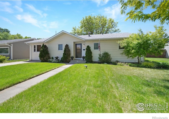 single story home with a front lawn