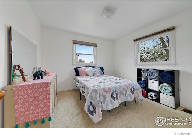 bedroom with light carpet