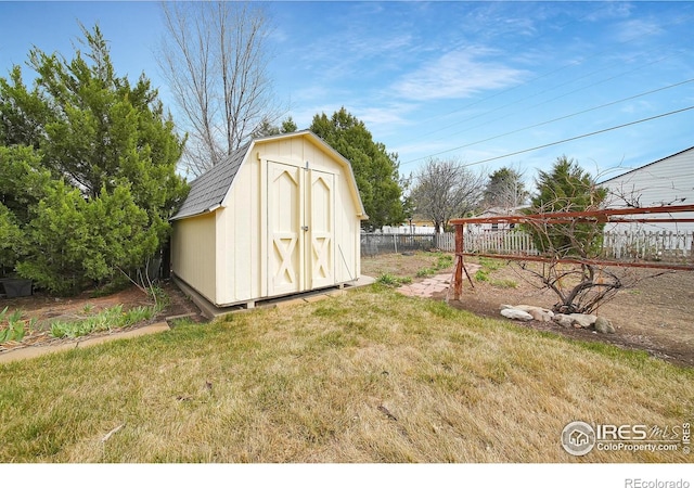 view of outbuilding with a lawn