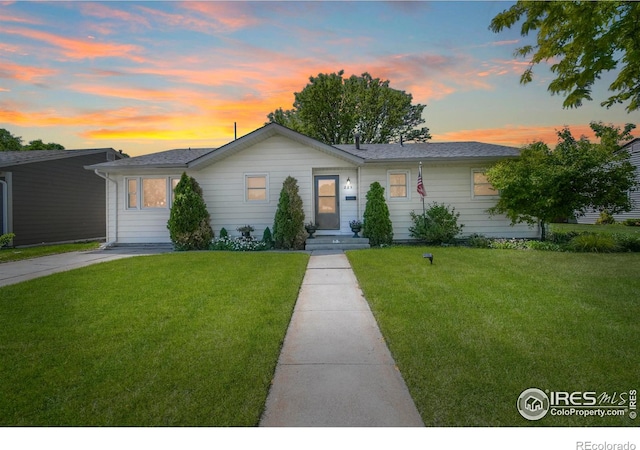 ranch-style house with a yard