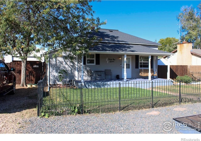 view of front of house with a front lawn and covered porch