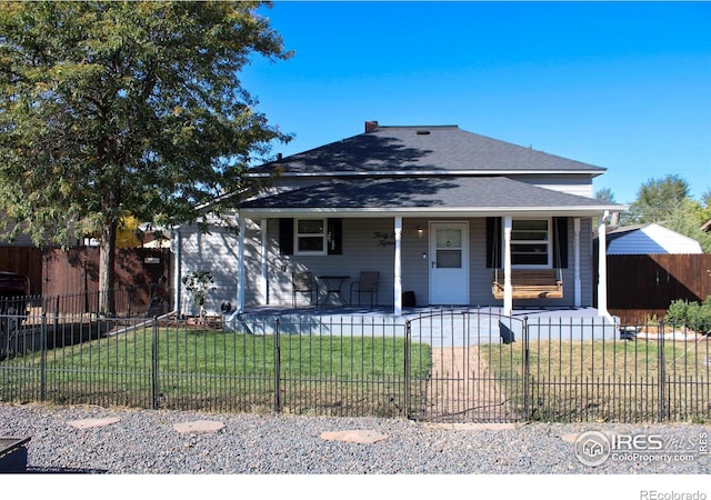 bungalow-style home featuring a front yard