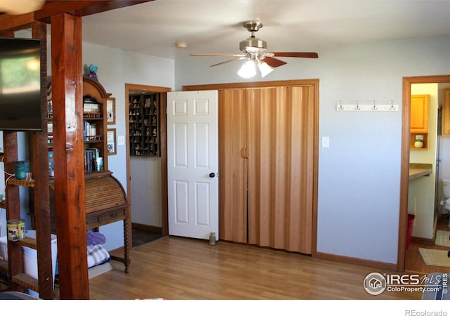 interior space featuring light hardwood / wood-style flooring and ensuite bath