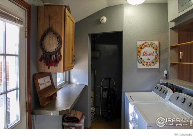 laundry room with cabinets and washing machine and dryer