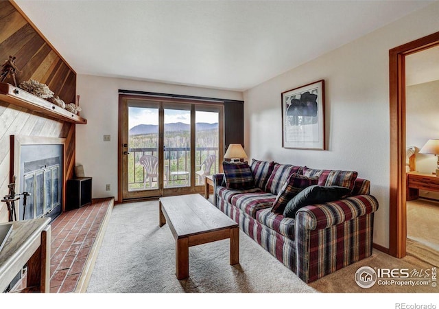 living room featuring a mountain view and light carpet