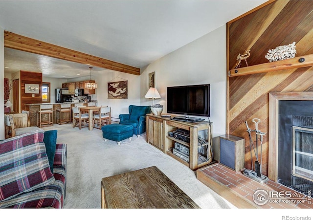 living room featuring light carpet and beam ceiling