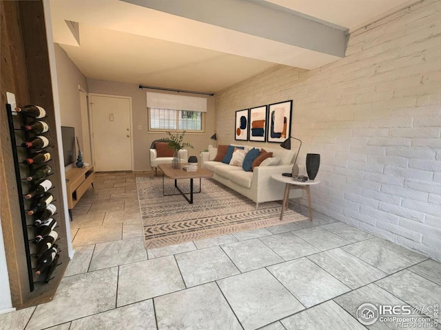 living room featuring brick wall