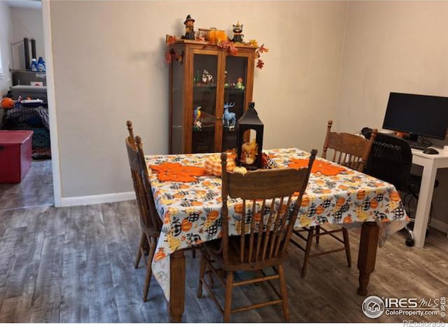 dining area featuring dark hardwood / wood-style flooring