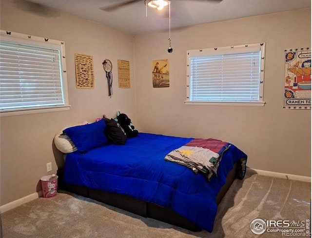 carpeted bedroom with ceiling fan