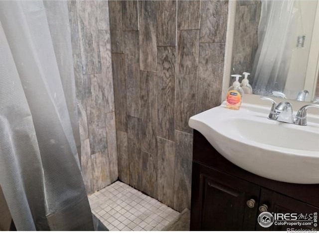 bathroom with vanity and curtained shower