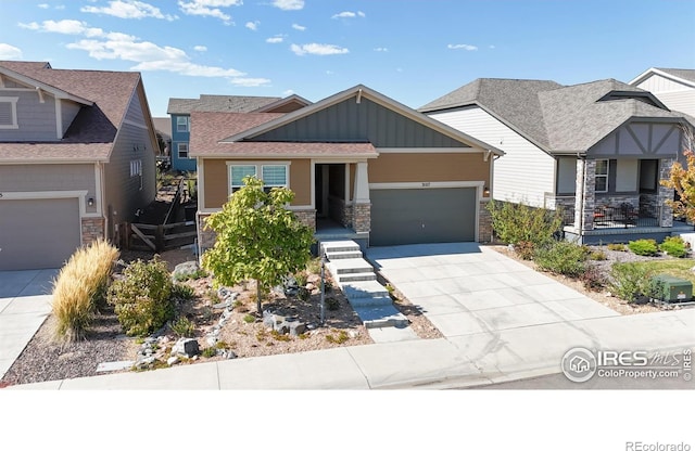 3107 Deering Lake Dr, Loveland, CO 80538 - craftsman inspired home with board and batten siding, driveway, stone siding, and a garage