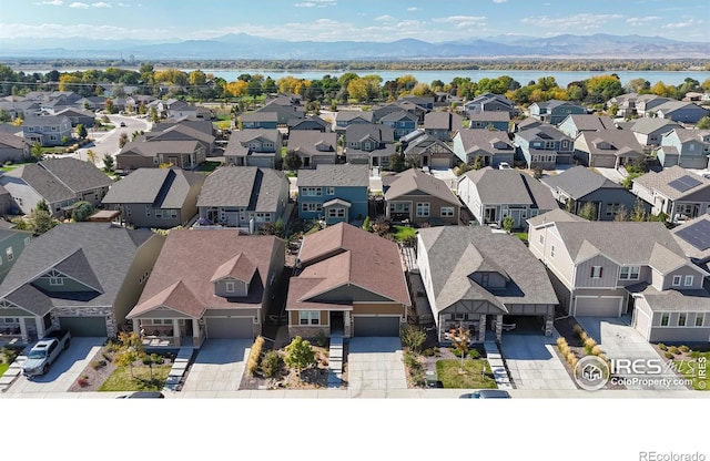3107 Deering Lake Dr, Loveland, CO 80538 - birds eye view of property with a residential view and a water and mountain view