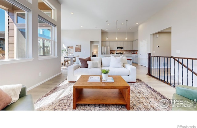 3107 Deering Lake Dr, Loveland, CO 80538 - living room with light wood-type flooring and recessed lighting