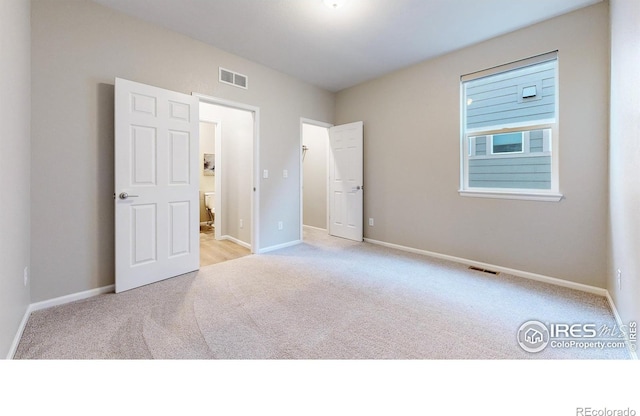 3107 Deering Lake Dr, Loveland, CO 80538 - unfurnished bedroom featuring baseboards, visible vents, and carpet floors