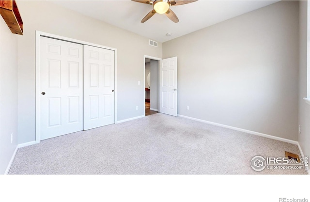 3107 Deering Lake Dr, Loveland, CO 80538 - unfurnished bedroom featuring a closet, ceiling fan, carpet floors, baseboards, and visible vents