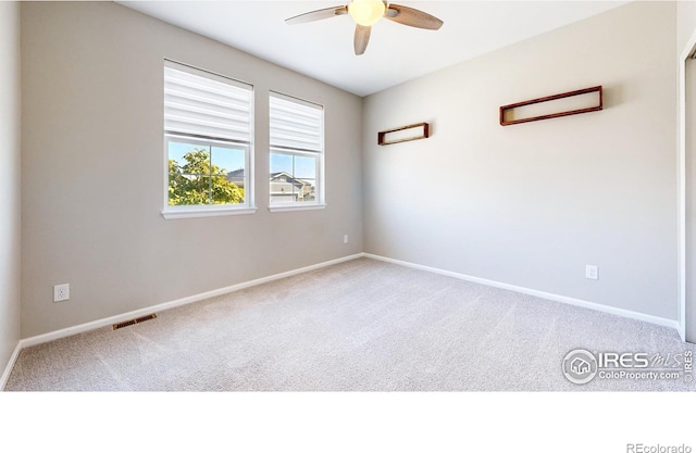 3107 Deering Lake Dr, Loveland, CO 80538 - unfurnished room with visible vents, baseboards, a ceiling fan, and carpet flooring