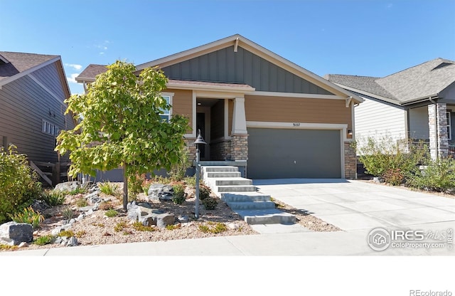 3107 Deering Lake Dr, Loveland, CO 80538 - craftsman-style house featuring board and batten siding, an attached garage, stone siding, and concrete driveway