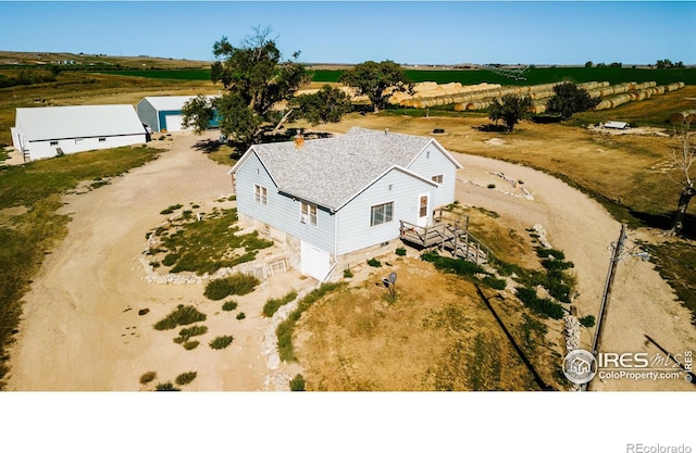 birds eye view of property featuring a rural view